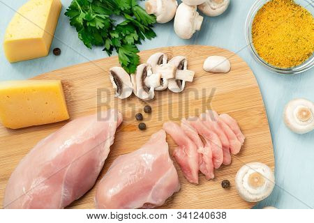 Slicing Chicken Breast Fillet For Cooking With Champignons And Cheese, Top View