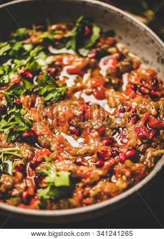 Babaganoush Cold Dip Seasoned With Parsley, Pomegranate Seeds In Pan