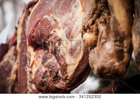 Serbian Ham, Called Prsut, Italian Style, Similar To Prosciutto Crudo, Hanging In The Countryside Of