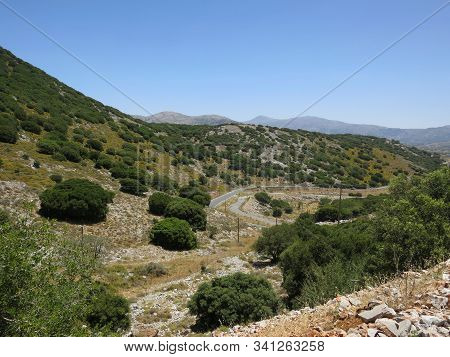 Beautiful Panorama Of Stone Mountains, Trees And Blue Sky