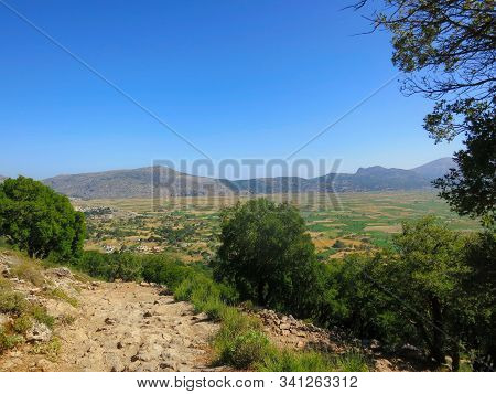 Beautiful Panorama Of Stone Mountains, Trees And Blue Sky