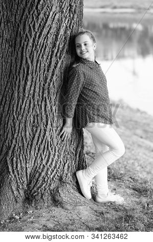 Feeling Free And Happy. Adorable Baby Girl. Small Baby With Cute Smile On Natural Landscape. Little 