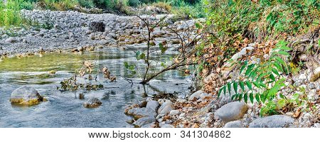 Wide Landscape Of Lively Rocky Stream Mollarino Amid The Italian Apennines Mountains Of The South-ea