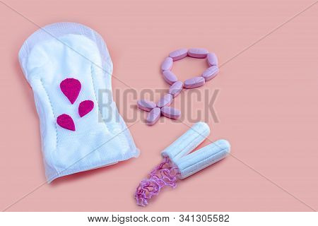 Protective Menstrual Pad, Cotton Tampons And Gender Symbol Made From Pink Pain Pills. The Concept Of