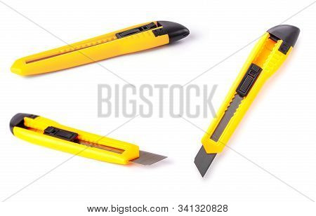 The Yellow Stationery Knife Isolated On White Background