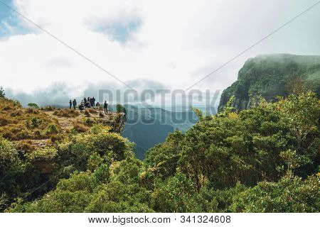 Cambara Do Sul, Brazil - July 18, 2019. People On The Edge Of Steep Rocky Cliff At Fortaleza Canyon 