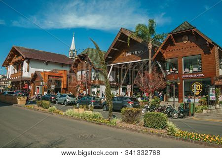 Gramado, Brazil - July 21, 2019. Buildings With Shops And People On Sidewalk At Borges De Medeiros A