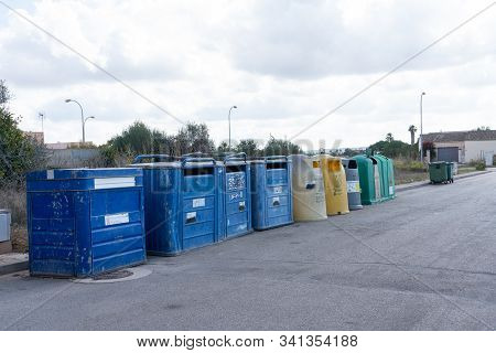 Campos, Balearic Islands / Spain - October 19, 2019: 
Recycling Bins Lined Up, In A Street On The Ou