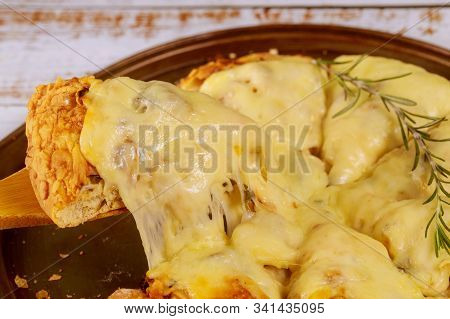 Sliced Hot M, Elted Cheese Pizza With Rosemary.