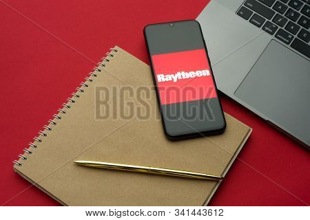 Tula, Russia - 06 December 2019: Raytheon Aerospace Logo Visible On Display Smartphone On Lattop Key