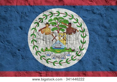 Belize Flag Depicted In Bright Paint Colors On Old Relief Plastering Wall. Textured Banner On Rough 