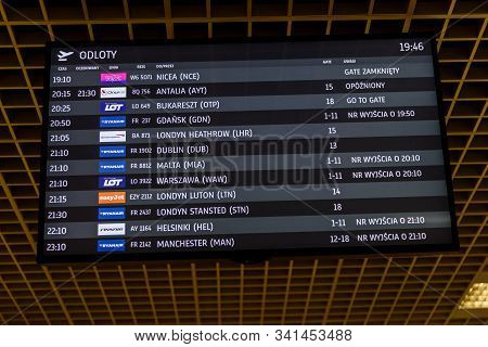 Krakow, Poland - August 08, 2019: Close-up View Of The Departure Timetable In The Balice Airport. In