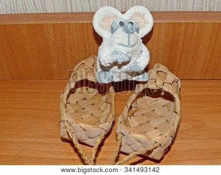 Bast Shoes And Little White Mouse. Lapti - Russian Old Wicker Traditional Peasant Shoes. According T