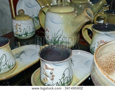 Coffee Service. Latgale Ceramics Is A Traditional Folk Craft. It Was Filled With Glaze Of Traditiona