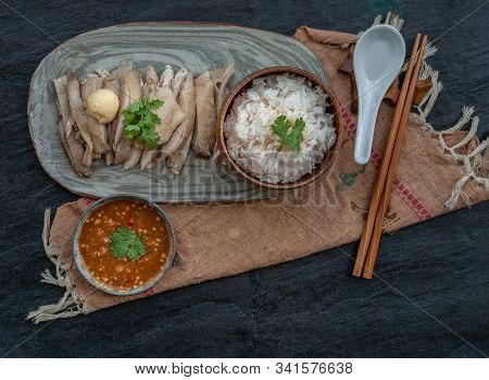 Asian Food Style Marinated Steamed Chicken (betong Chickken) With Rice And Sauce On Ceramic Plate. T