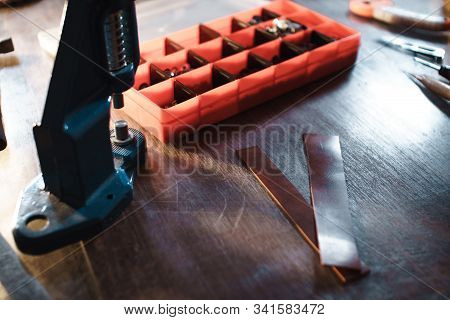 Tanner Workplace In Soft Focus. Leatherwork Concept.