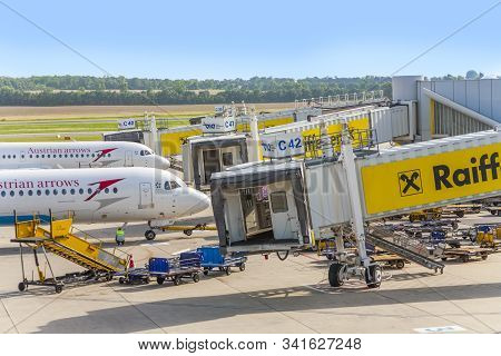 Vienna, Austria - July 23, 2009: Aircrafts At Boarding Gate In Vienna International Airport Schwecha