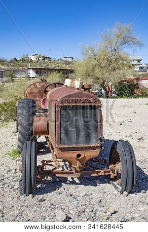 Oatman Ghost Town,   Usa - March 7, 2019: Old Rotten Tractor Brand Mc Cormic-deering Along Historica
