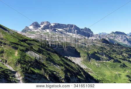 View Of The Mountain Peaks Mutteristock And Ochsenchopf Above The Alpine Lake Wagitalersee (waegital