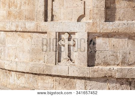 Jerusalem, Israel, December 28, 2018 : A Large Stone Cross Carved From Stone On The St. Nicholas Chu
