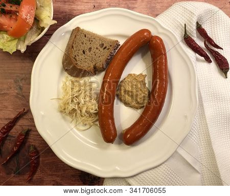 Debreziner Sausages With Mustard And Fresh Horseradish.
