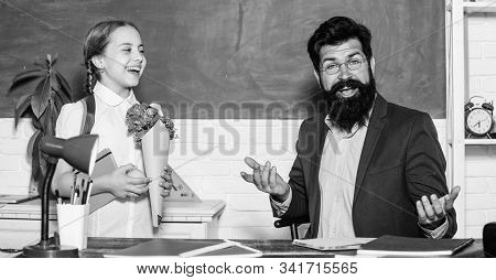 Flower Present For Best Teacher. Teachers Day. Daugghter And Father With Flowers. Small School Girl 