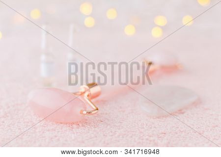 Real Rose Quartz Facial Roller, Gua Sha Massage Stone And Face Serum In Ampoules, Selective Focus