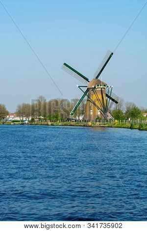 Waterways Of North Holland And View On Traditional Dutch Wind Mill, Dutch Lifestyle Landscape