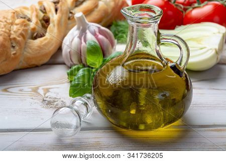 Virgin Natural Olive Oil Is Glass Bottle, Served With Traditional Mediterranean Food, Fresh Tomatoes