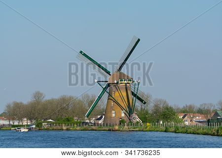 Waterways Of North Holland And View On Traditional Dutch Wind Mill, Dutch Lifestyle Landscape