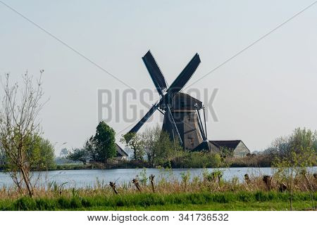 Waterways Of North Holland And View On Traditional Dutch Wind Mill, Spring Landscape
