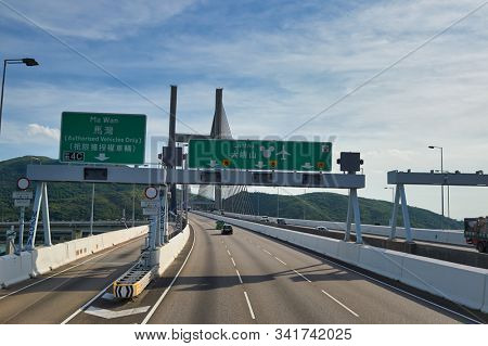 HONG KONG, CHINA - JUNE 18, 2015: view of the Kap Shui Mun Bridge seen from second desk of a double decker bus in Hong Kong in the daytime. 