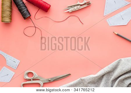 Sewing Wokrshop. Textile, Pattern, Scissors, Thread On Pink Background Top-down Copy Space
