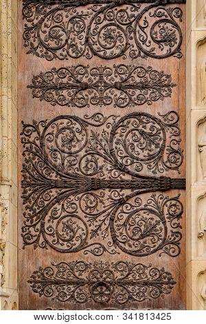 Ornament Twirly Metal Fittings On Ancient Medieval Door Of Cathedral Of The Notre-dame, Paris
