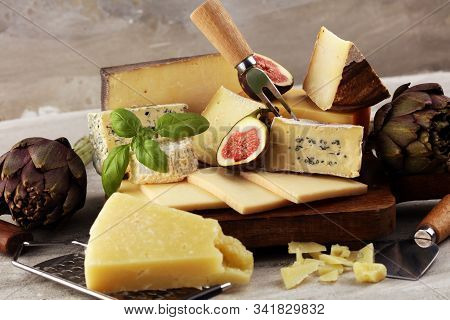 Different Sorts Of Cheese. Cheese Platter With Different Cheese And Spice