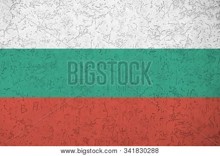 Bulgaria Flag Depicted In Bright Paint Colors On Old Relief Plastering Wall. Textured Banner On Roug