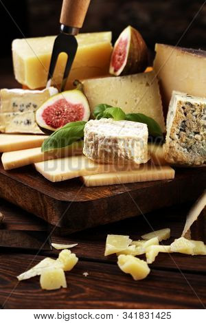 Different Sorts Of Cheese. Cheese Platter With Different Cheese And Spice