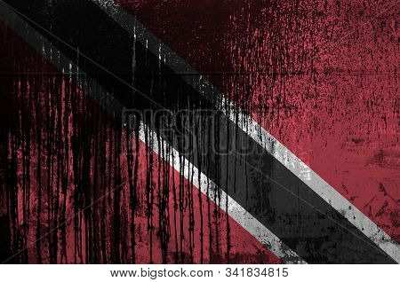 Trinidad And Tobago Flag Depicted In Paint Colors On Old And Dirty Oil Barrel Wall Closeup. Textured