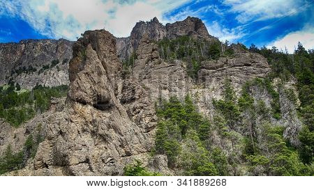 Great Mountain Seen From The Forest, There Is A Lot Of Vegetation Around, Blue Sky With Clouds. Cerr