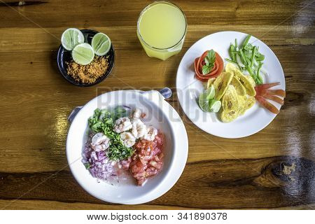 Ecuadorian Shrimp Cebiche Served With Fried Banana And Ground Peanut