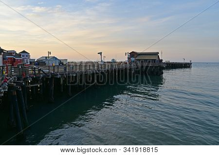 Santa Barbara, California - May 18, 2019: Stearns Wharf At Sunrise Under Colorful High Altitude Clou
