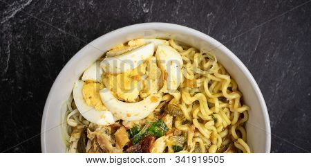 Soto Ayam Is Traditional Food From Indonesia, Served With Chicken, Noodles, Egg, Sambal And Fried On