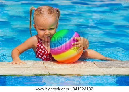 Happy Family In Swimming Pool. Smiling Child Swim, Dive In Pool With Fun, Play Active Games With Bal