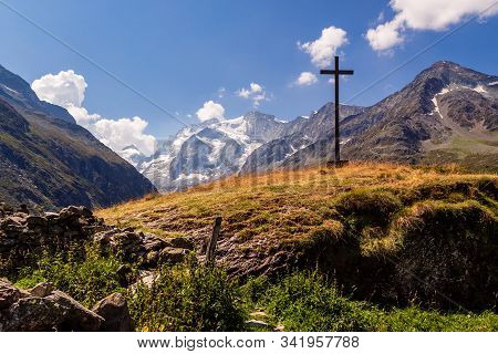 Big Wooden Cross High Up In The Pennine Alps Near Lake Arpitetta (ayer) In The Swiss Canton Valais O