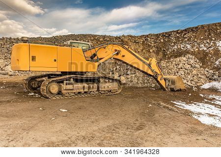 Excavator Moving Stone In An Open Pit Mine In Spain