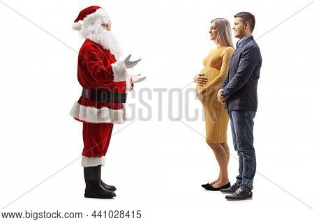 Full length profile shot of santa claus talking to a pregnant woman and her husband isolated on white backgroundund