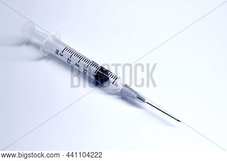 3 Ml Plastic Syringe With Needle Isolated On The White Background, Blue Tone Color
