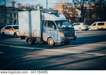Hyundai H-100 Cargo Van In The City Street. Hyundai Porter 2 In Fast Motion With Blurred Urban Backg