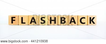 Flashback Symbol. The Concept Word Flashback On Wooden Cubes. Beautiful White Table, White Backgroun