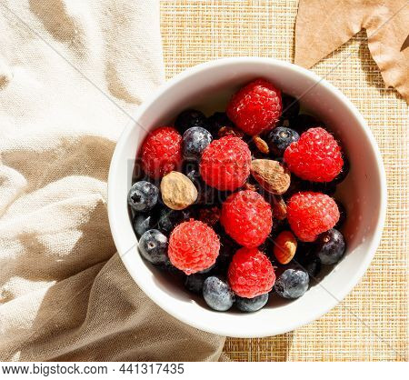 Autumn Style Breakfast With Red Fruits, Nuts, Honey, Milk And Toast